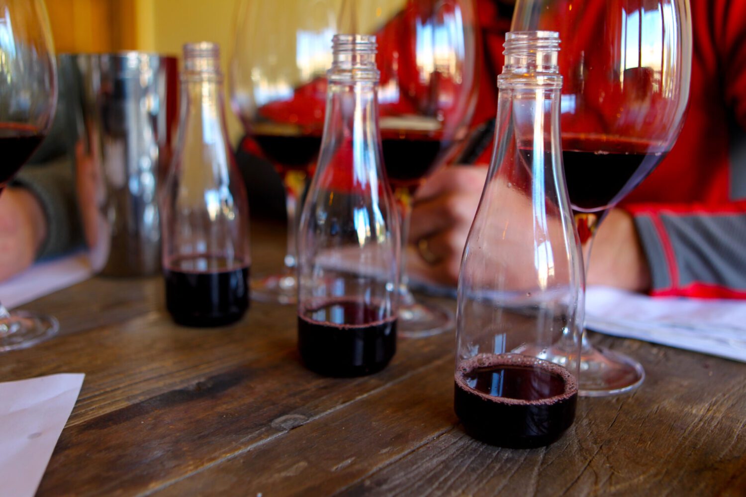 small bottles of wine are lined up and blind tasted in a blending trial
